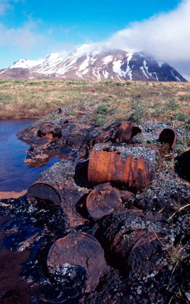 Oil pollution caused by the improper discarding of oil drums at a remote US Coast Guard station on Attu Island Aleutian Islands, Alaska, United States of America.