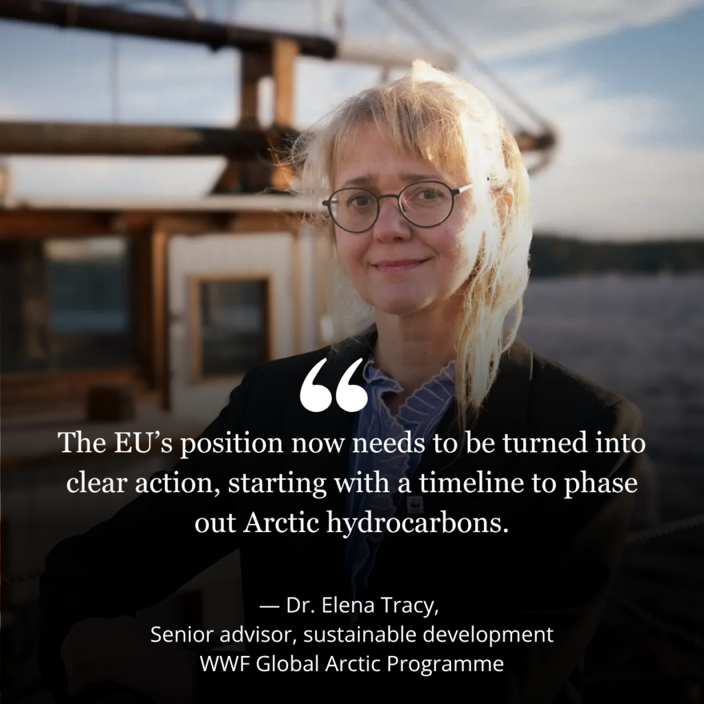 Picture with text. Picture of a woman in front of a boat and water.